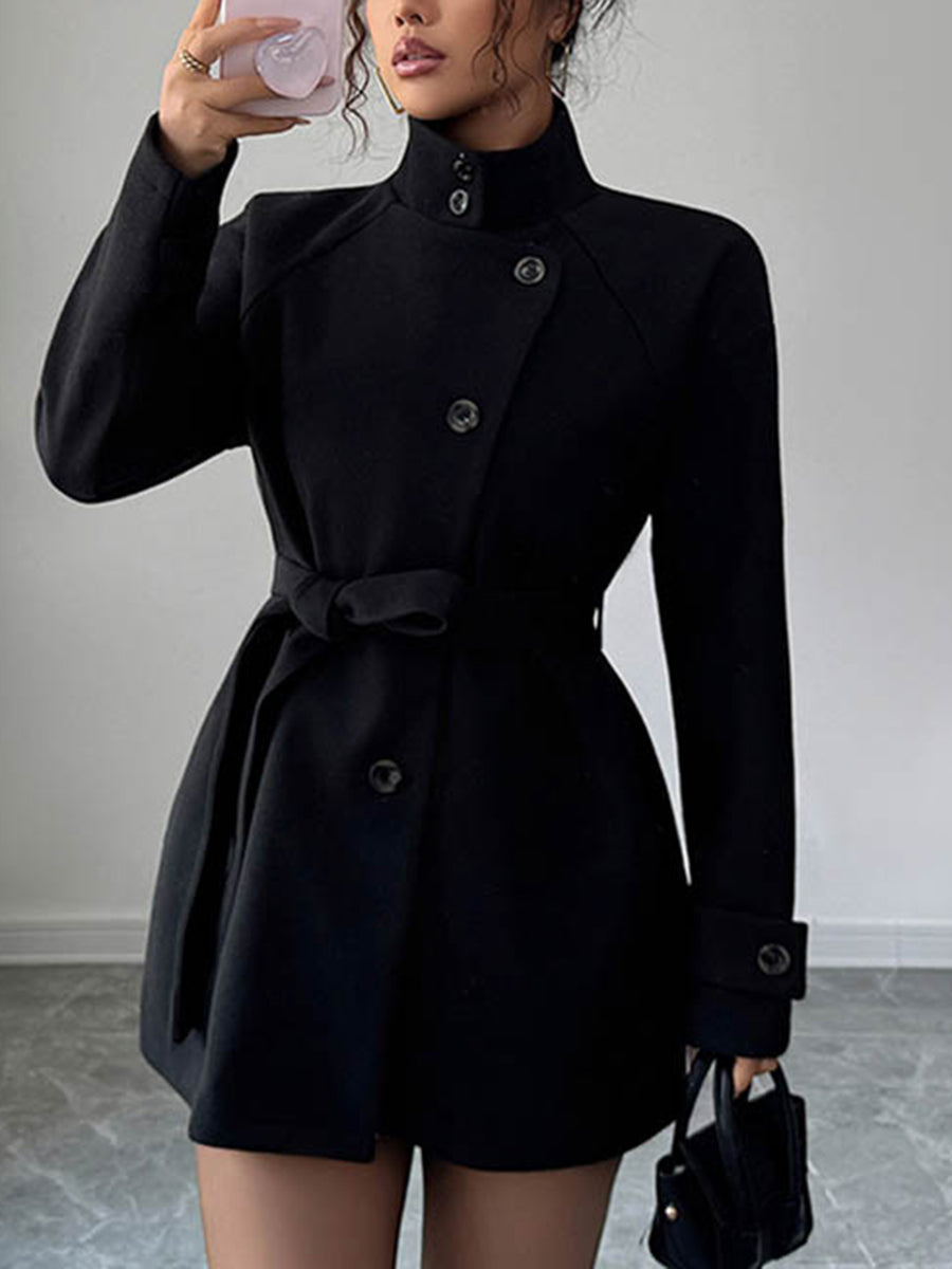 Short belted coat with a stand collar and an asymmetric button front