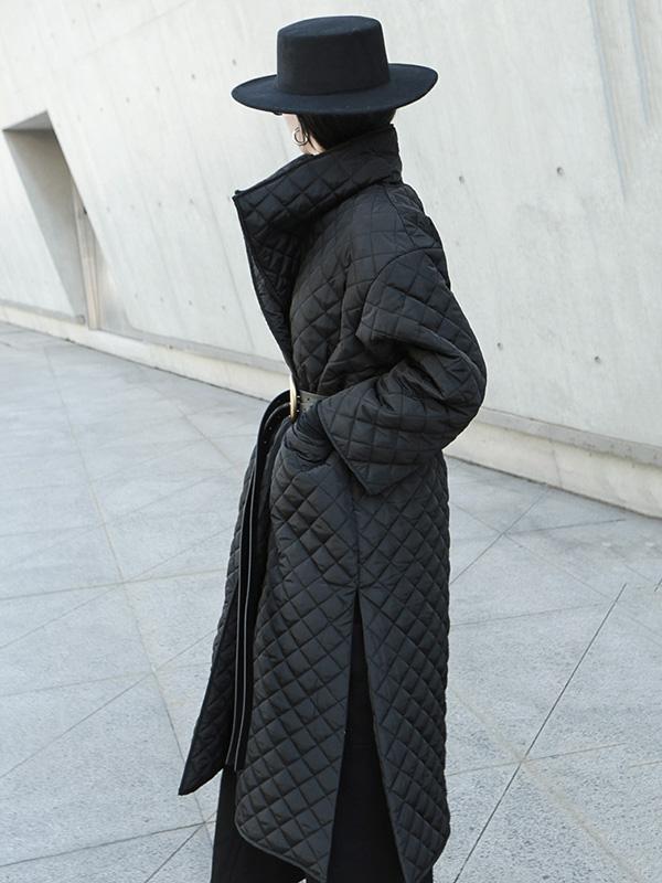 Long black quilted wrap coat with a fold-over collar and ring-buckle belt