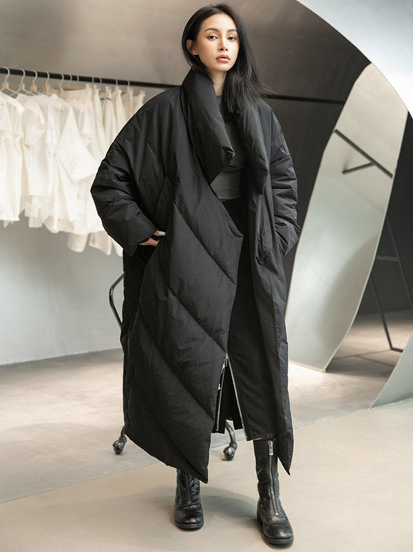 Long black padded coat with a scarf collar and diagonal quilting