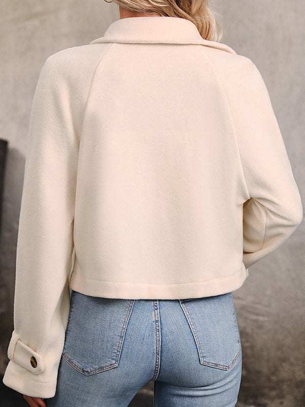 Cream cropped fleece jacket with a wide lapel and two rows of buttons
