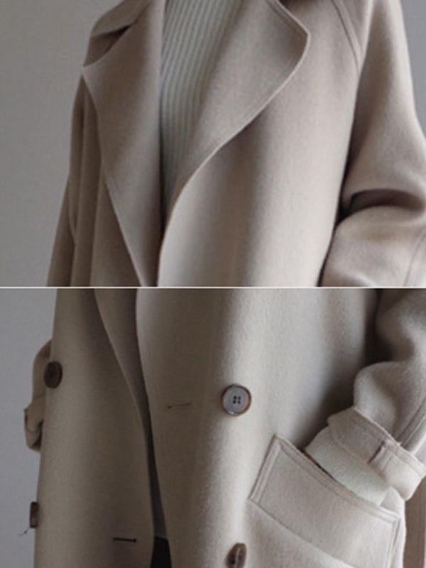 Belted longline coat with a notch lapel and welt pockets