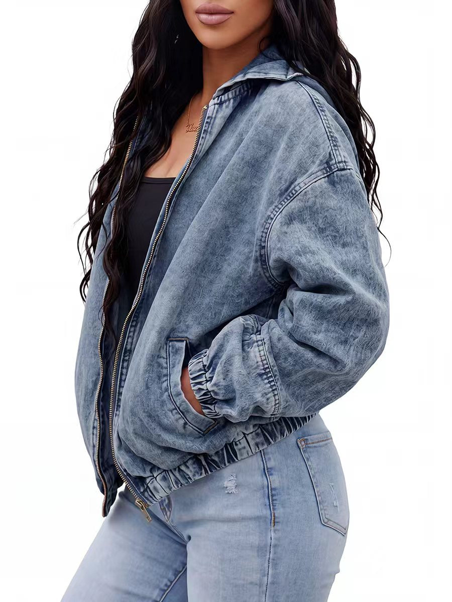 Light wash hooded denim jacket with a zip front and gathered cuffs