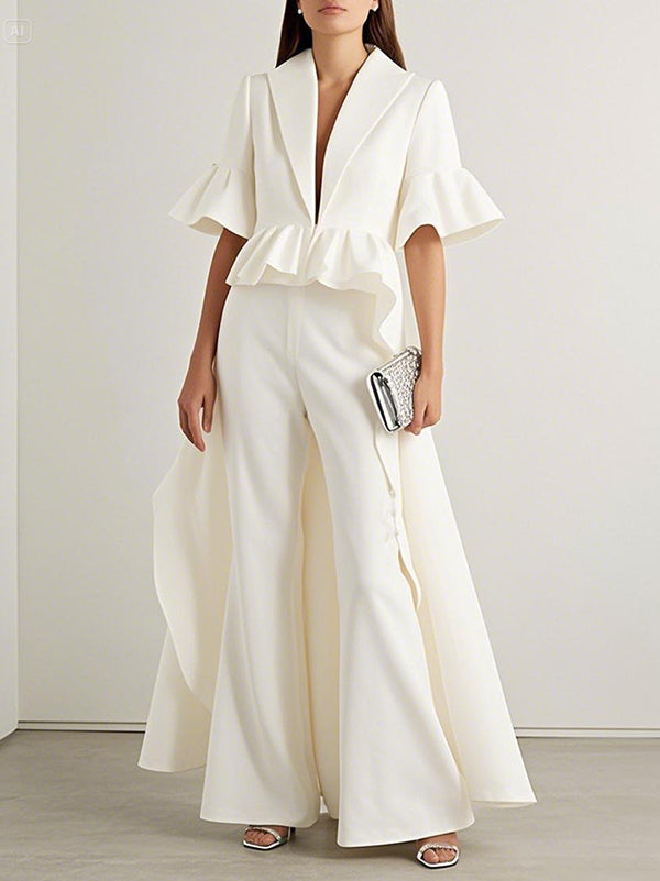 White longline blouse with a waist ruffle and flared half sleeves in white