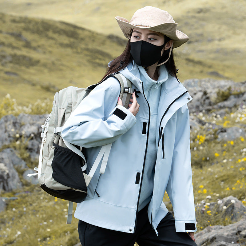 Women's 3-in-1 hooded outdoor jacket with a zip chest pocket and zip-out inner jacket