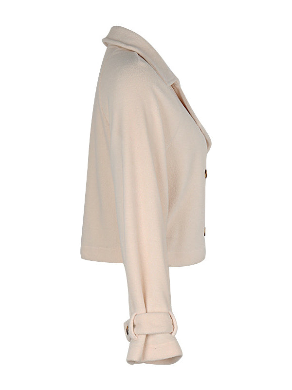 Cream cropped fleece jacket with a wide lapel and two rows of buttons