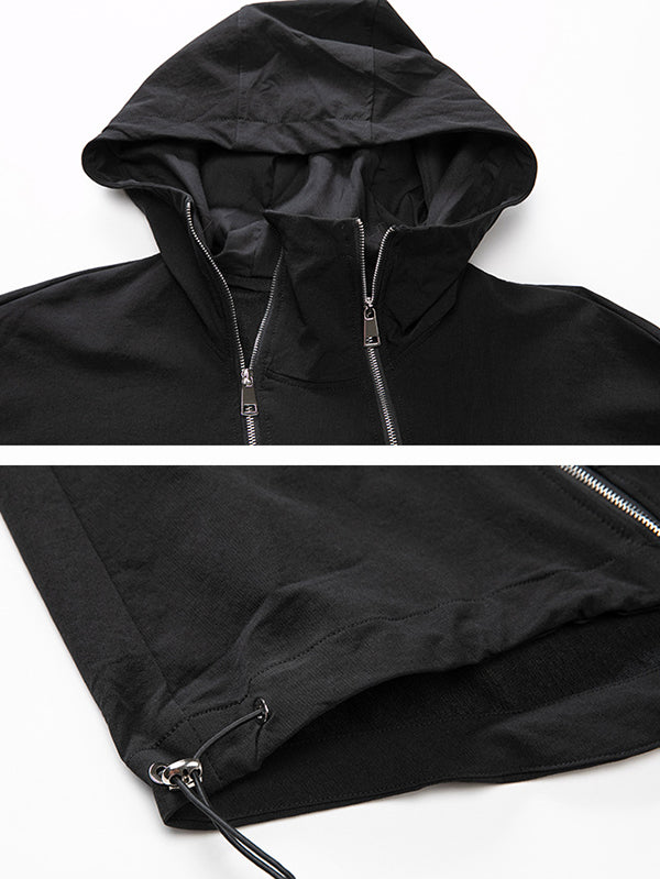 Oversized black hooded jacket with an off-centre zip and drawstring hem