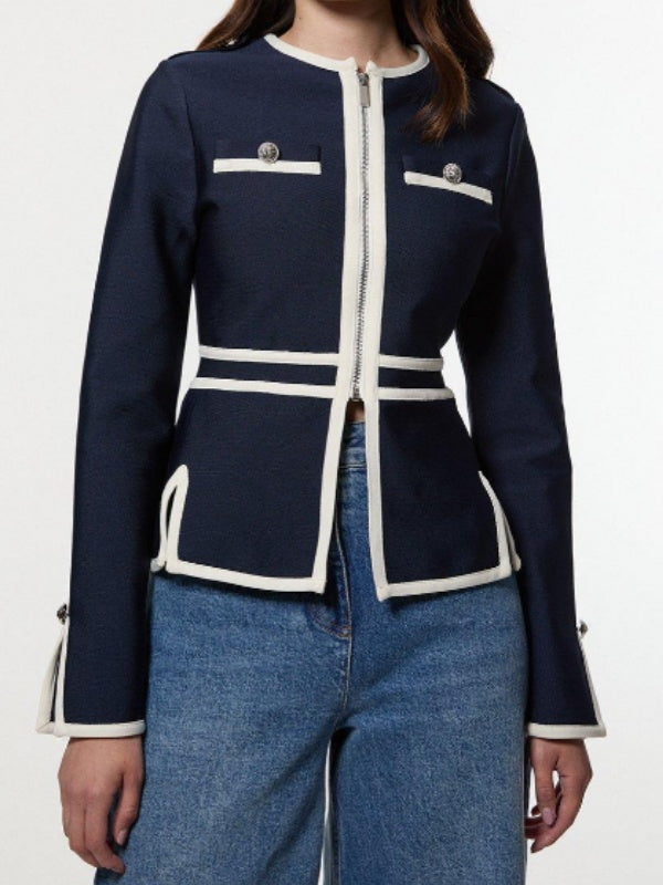 Navy jacket with cream contrast piping, a round neck and zip front in navy