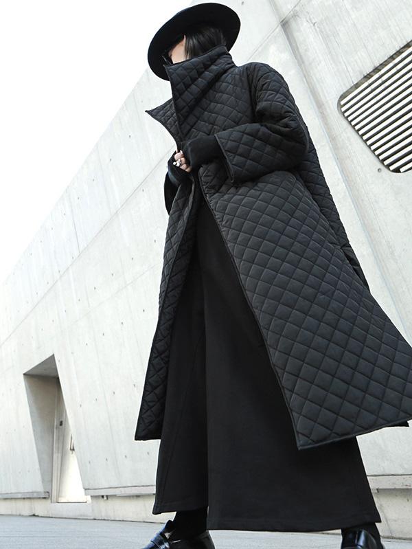 Long black quilted wrap coat with a fold-over collar and ring-buckle belt