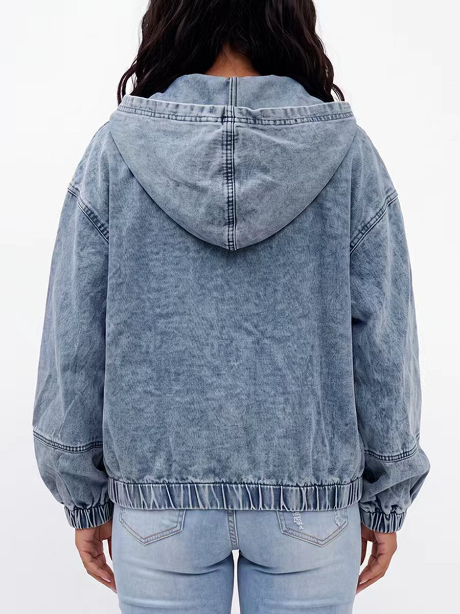 Light wash hooded denim jacket with a zip front and gathered cuffs