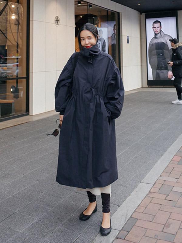 Longline hooded coat with a drawstring waist and deep pockets