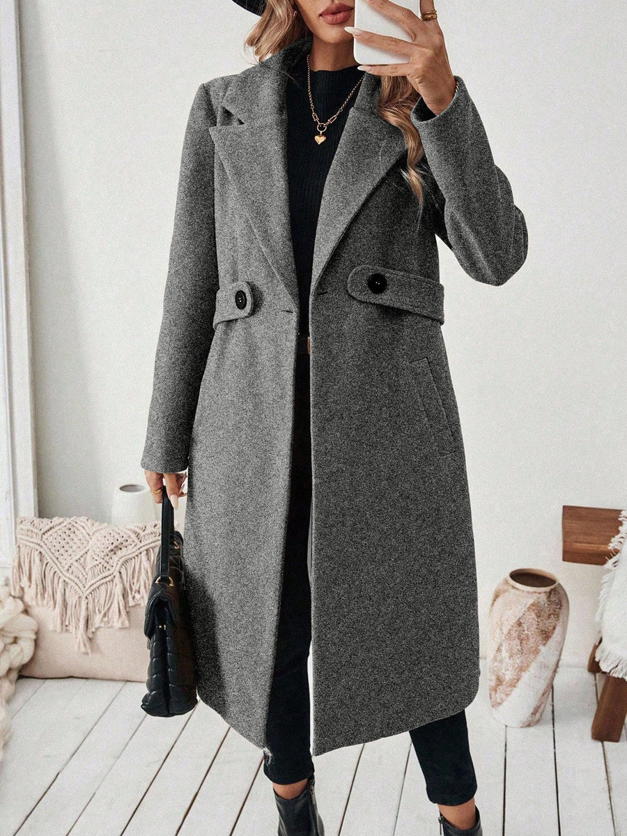 Longline coat with a wide notch lapel and a button at the waist
