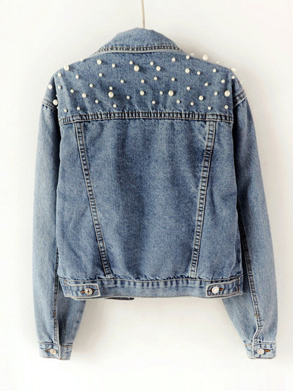 Light wash denim jacket with pearl-effect studs on the shoulders in light wash