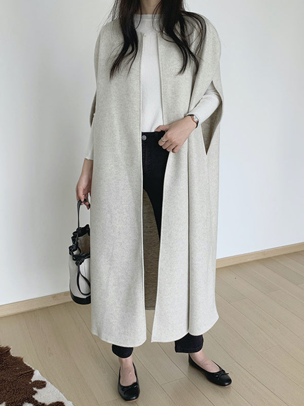 Sleeveless longline cape with a round neck and open front in beige