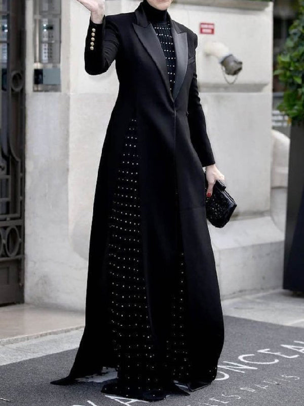 Floor-length black coat with a satin peak lapel and side splits in black