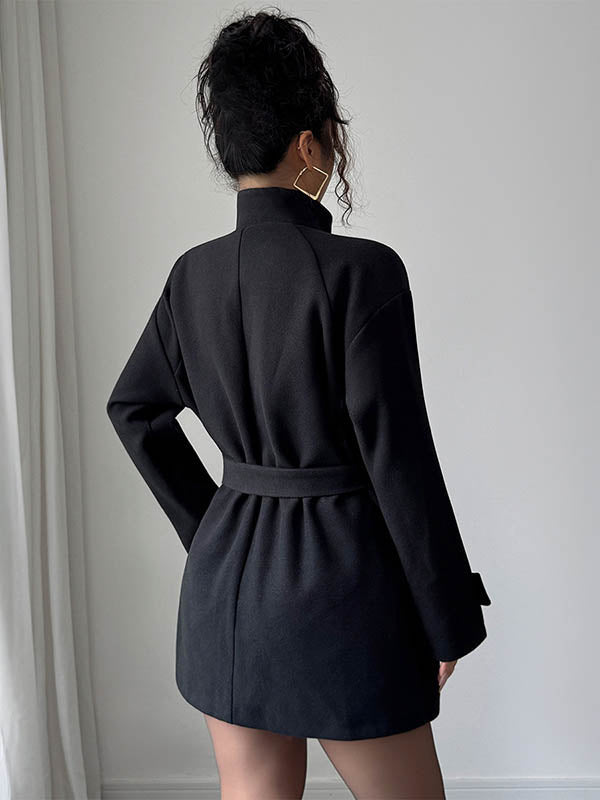 Short belted coat with a stand collar and an asymmetric button front
