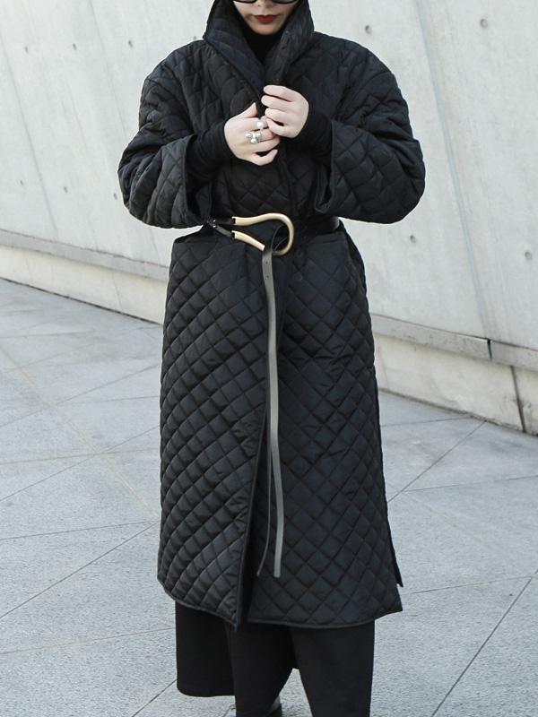 Long black quilted wrap coat with a fold-over collar and ring-buckle belt