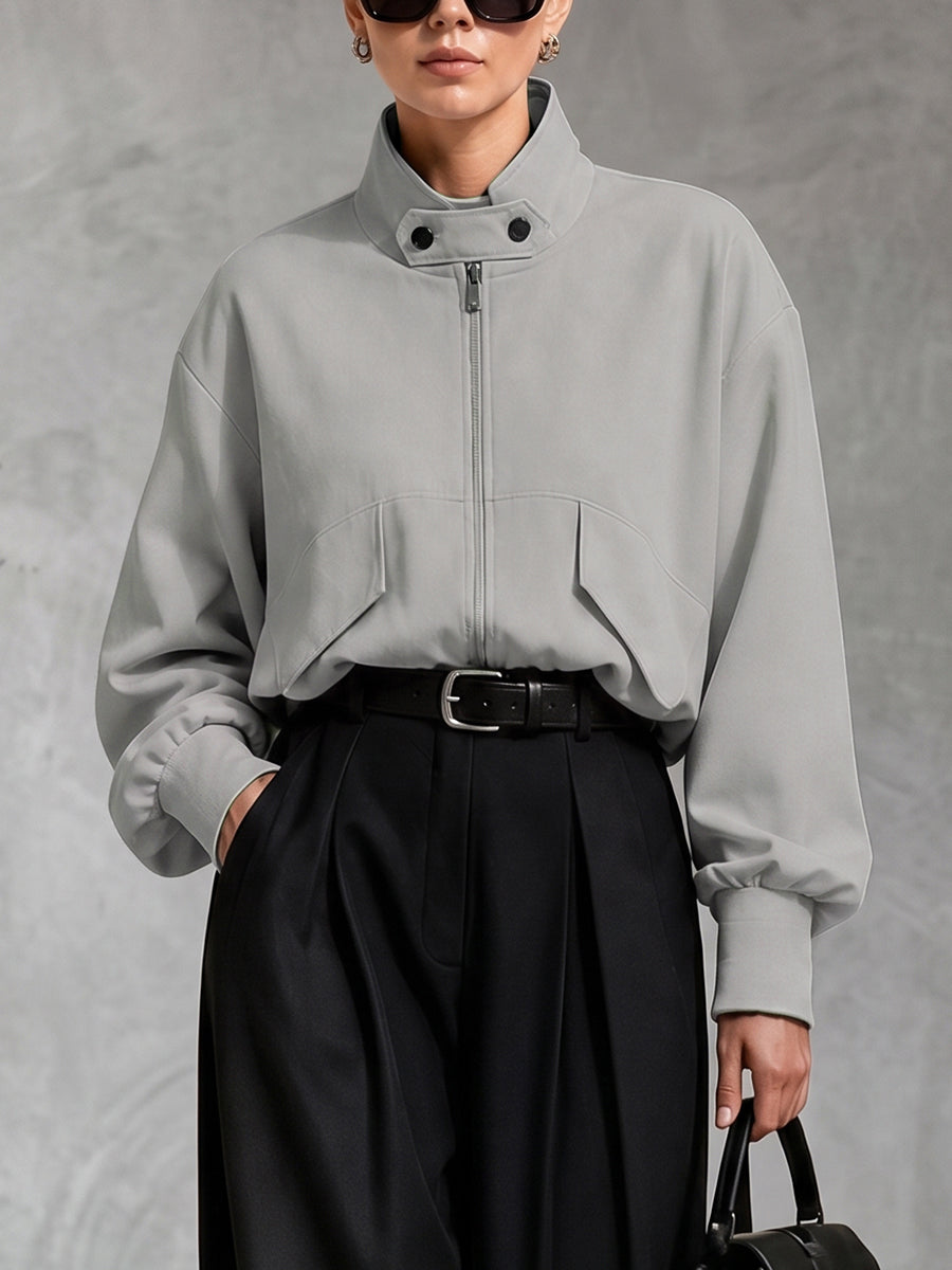 Oversized grey jacket with a high stand collar and zip front