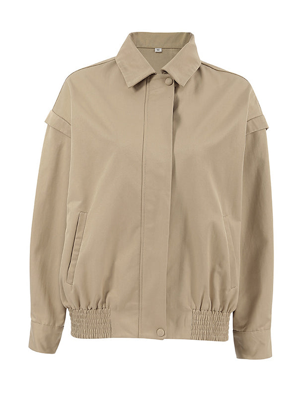Boxy khaki utility jacket with a wide collar and flaps over the shoulder