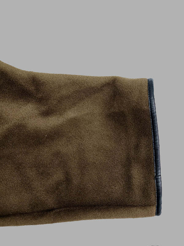 Cropped cape jacket with a high stand collar and contrast edging