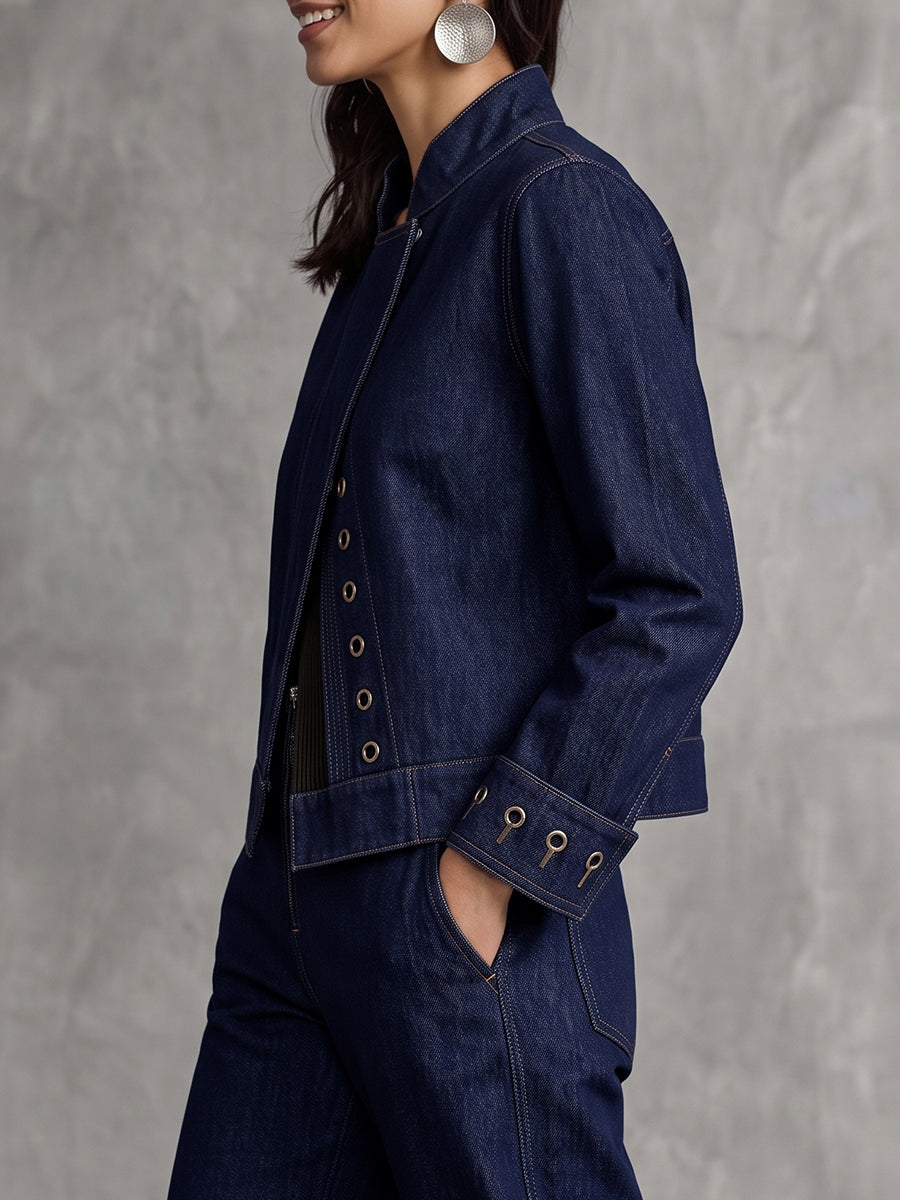 Cropped indigo denim jacket with a stand collar and eyelet trim