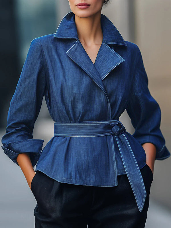 Blue denim jacket with a wide lapel collar and a sash tied at the waist in blue