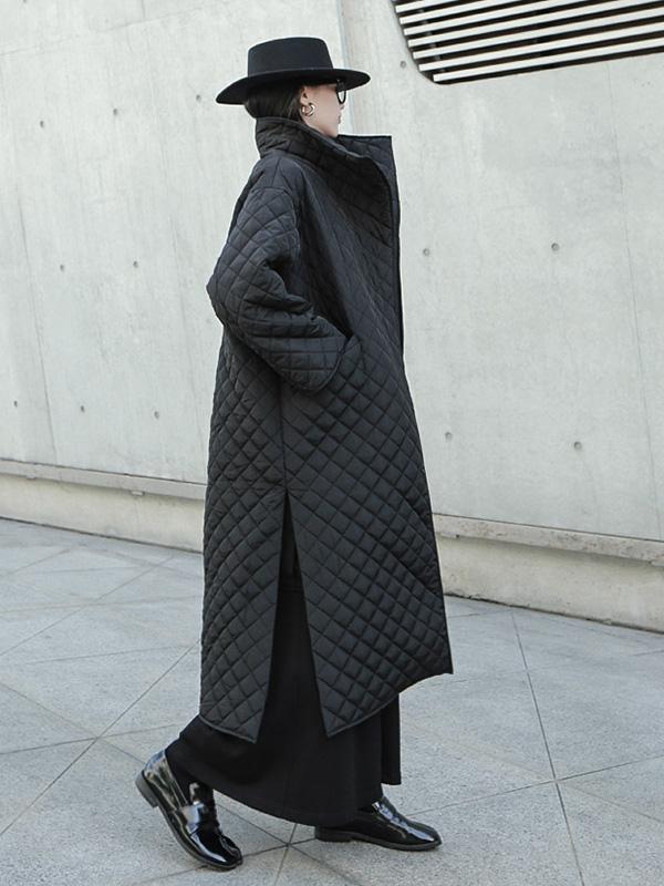 Long black quilted wrap coat with a fold-over collar and ring-buckle belt
