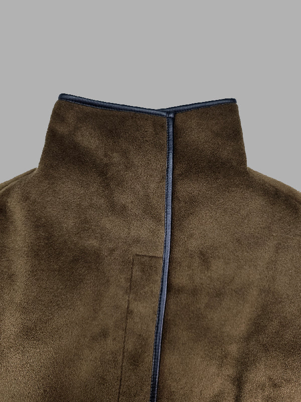 Cropped cape jacket with a high stand collar and contrast edging