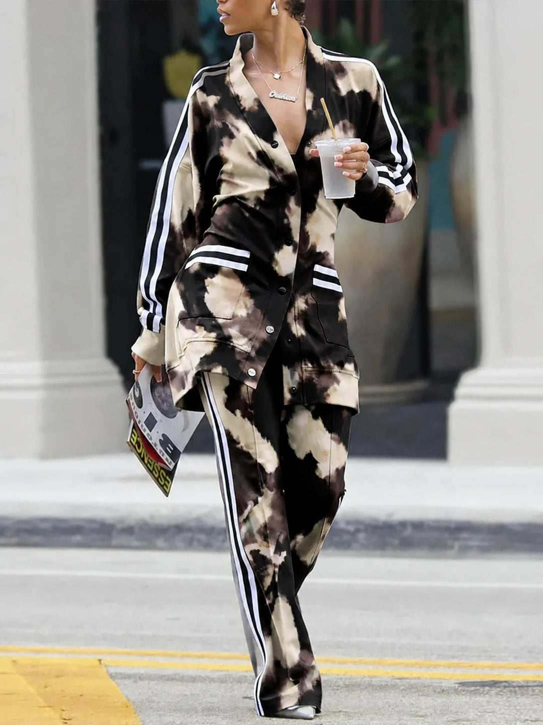 Tie-dye cardigan in black and cream with striped sleeves