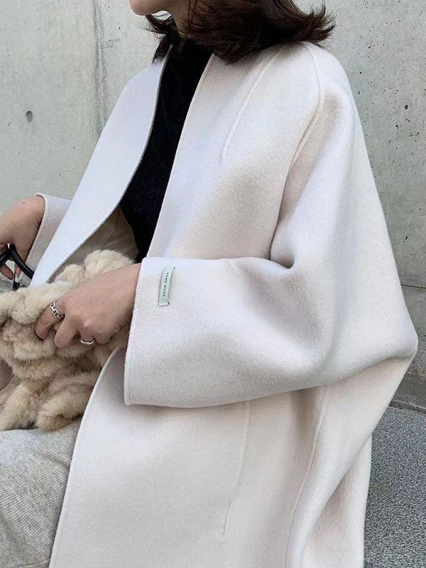 Collarless longline coat with dropped sleeves and an open front
