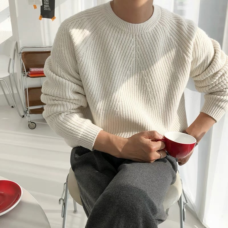 Oversized rib knit jumper worn loose over trousers
