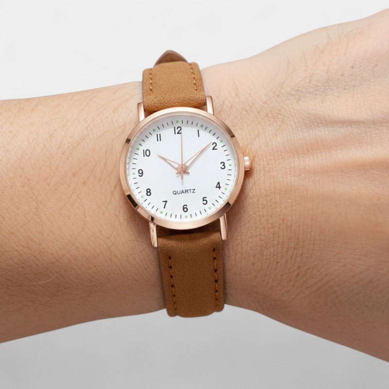 Watch with rose gold tone case and suede look strap