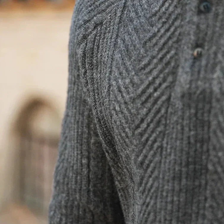 Men's knitted polo jumper worn with tailored trousers