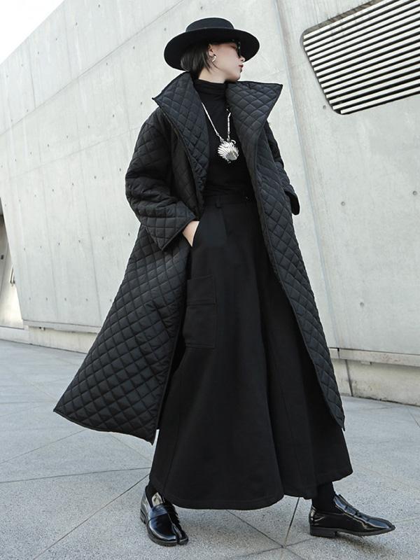 Long black quilted wrap coat with a fold-over collar and ring-buckle belt