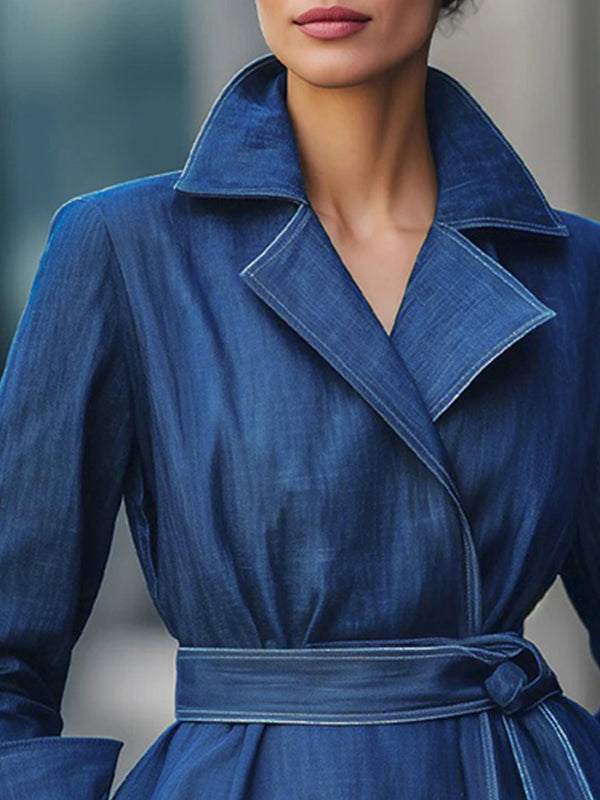 Blue denim jacket with a wide lapel collar and a sash tied at the waist
