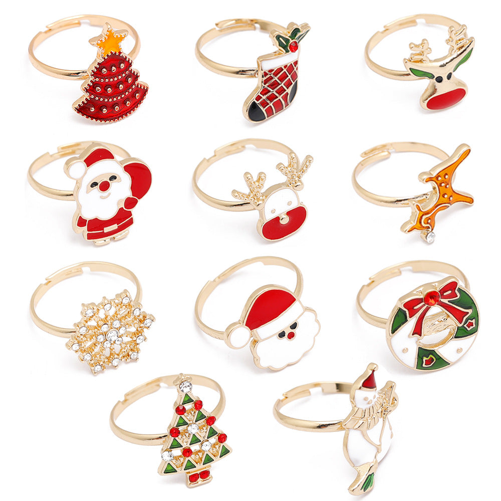 Adjustable gold-tone Christmas ring with an open band and a festive motif