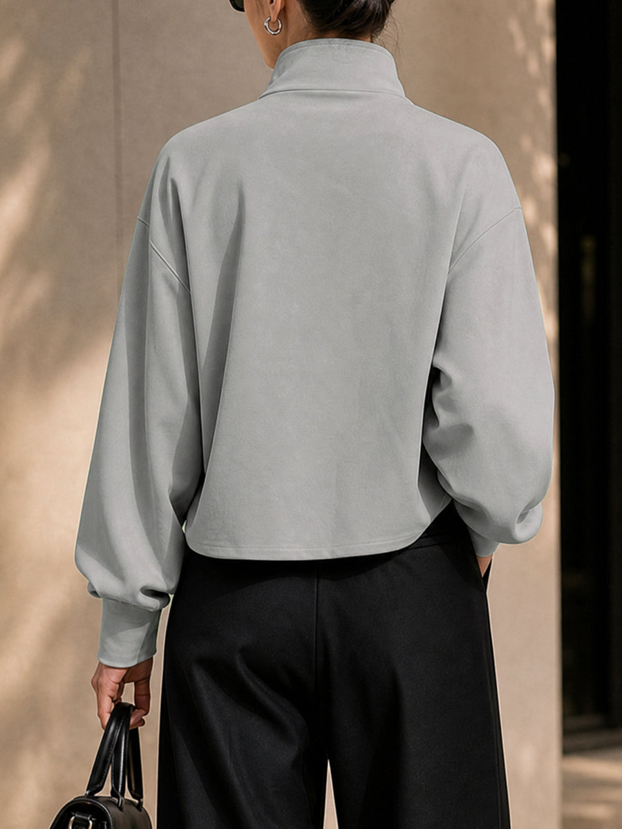 Oversized grey jacket with a high stand collar and zip front