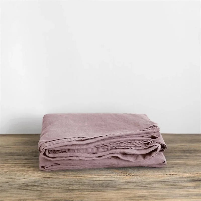 Airy woven sheet with a washed look on a bed - dusty pink