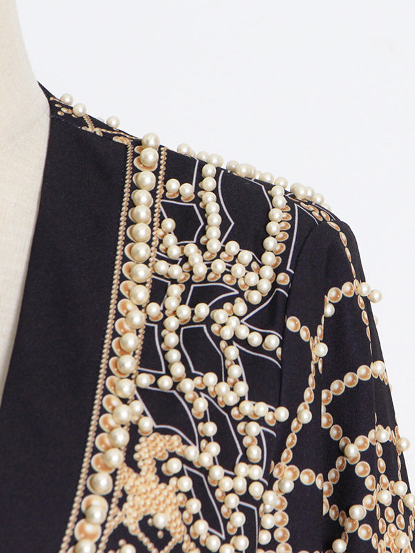 Beaded blazer with an ornamental pattern and a deep V-neck