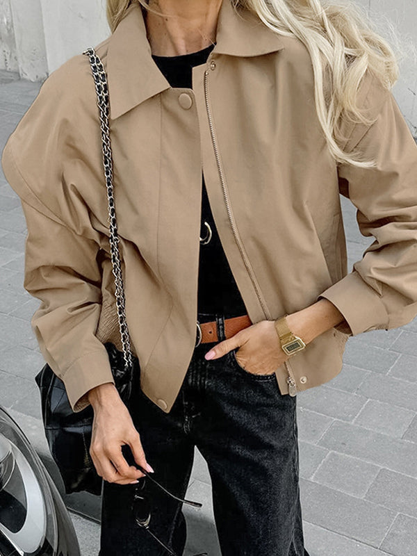 Boxy khaki utility jacket with a wide collar and flaps over the shoulder