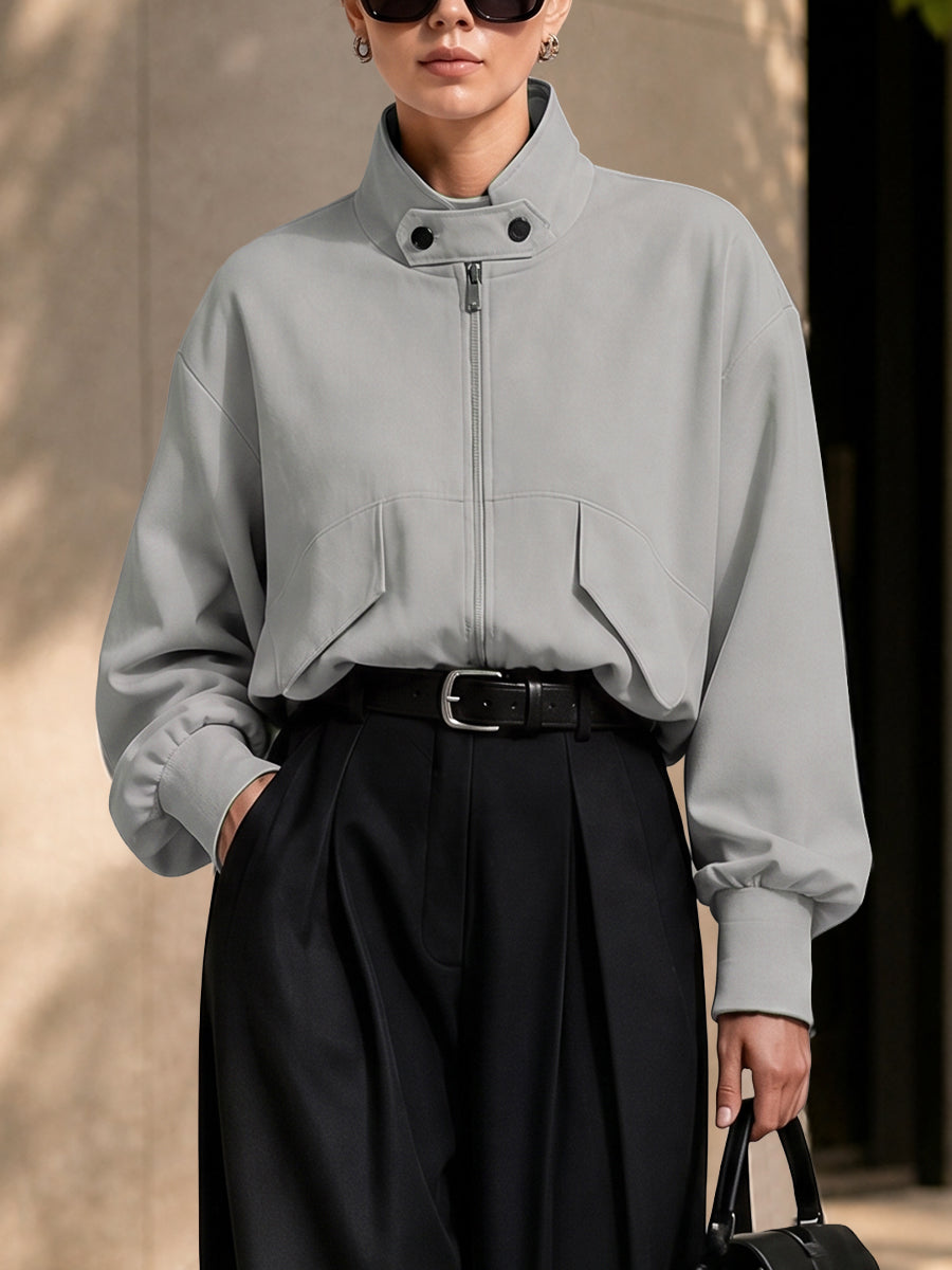 Oversized grey jacket with a high stand collar and zip front