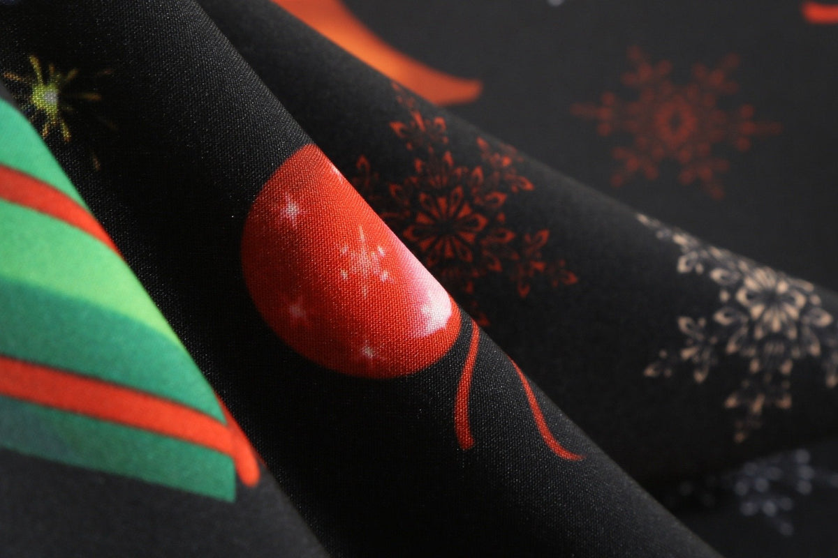 Women's black Christmas dress with scalloped V-neck and angel print skirt