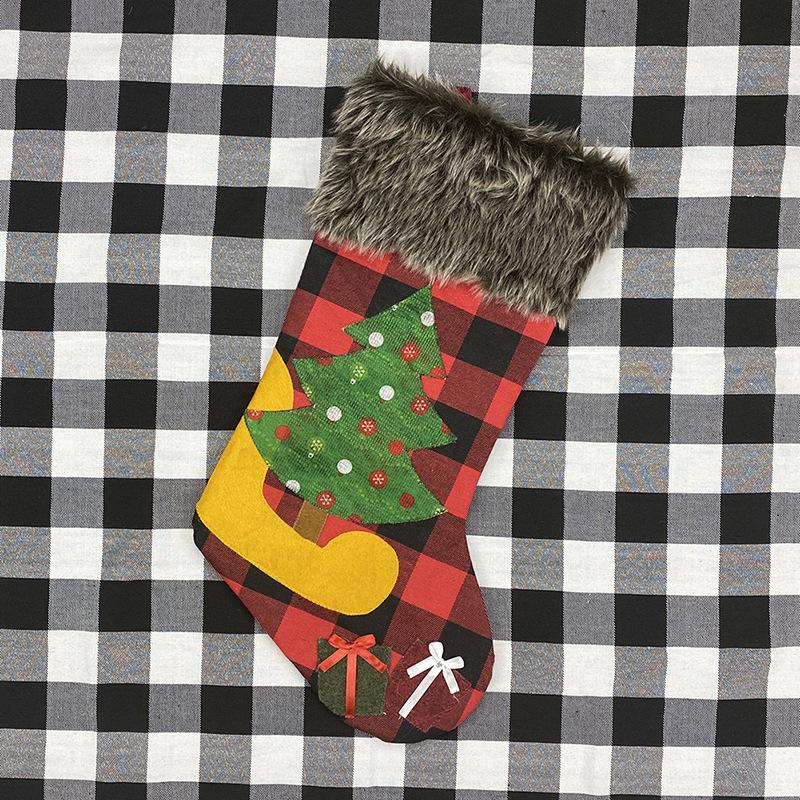 Red and black buffalo check Christmas stocking with a grey faux fur cuff - christmas tree