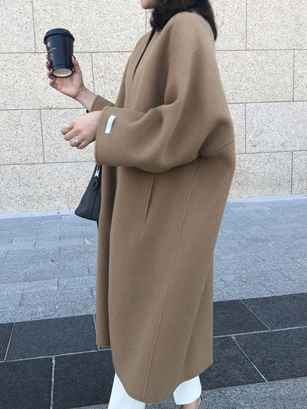 Collarless longline coat with dropped sleeves and an open front