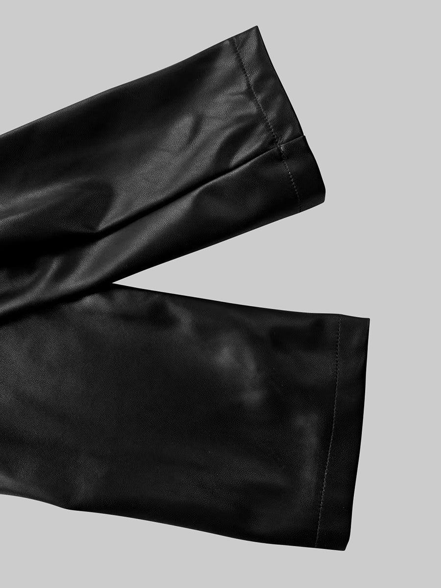 Fitted black faux leather blazer with a peak lapel and gold-tone buttons