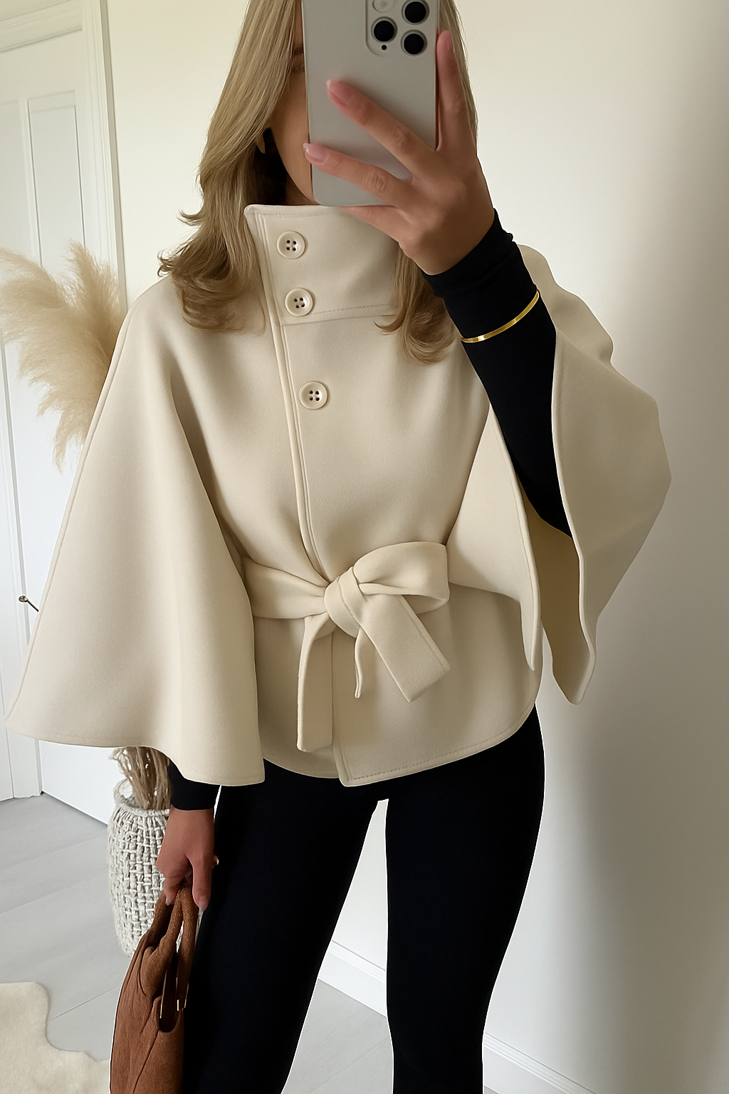 Women's cape coat with a high collar and tie belt