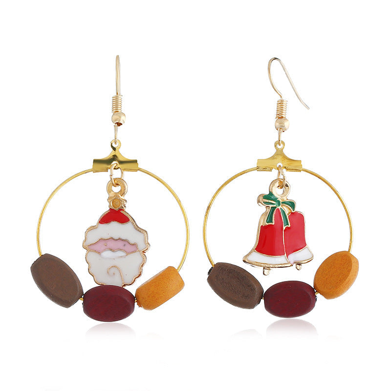 Gold-tone Christmas hoop earrings with beads and a festive charm inside the hoop - father christmas and bell
