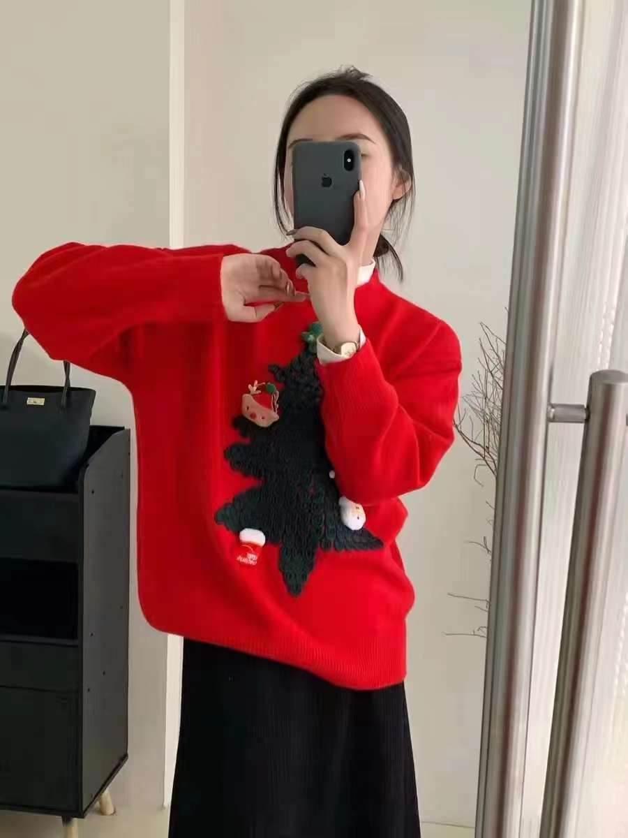 Women's knitted Christmas jumper with a raised 3D tree and small appliqués