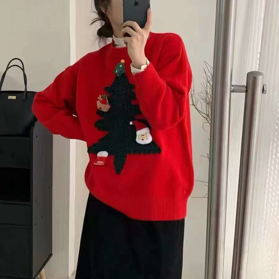Women's knitted Christmas jumper with a raised 3D tree and small appliqués