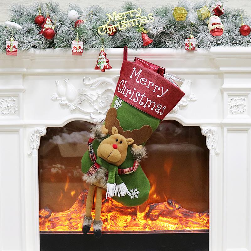 Large Christmas stocking with a dangling-leg character and Merry Christmas cuff