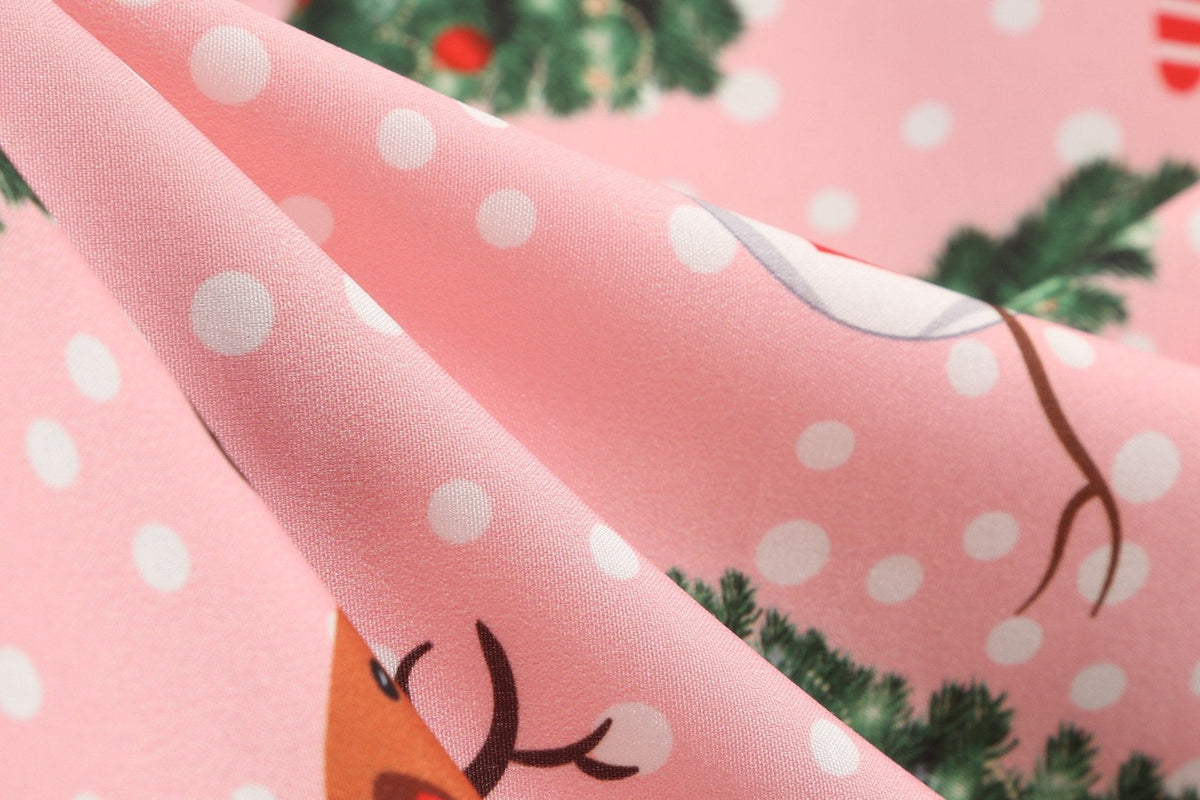 Women's Christmas swing dress with black bodice, bow belt and festive print
